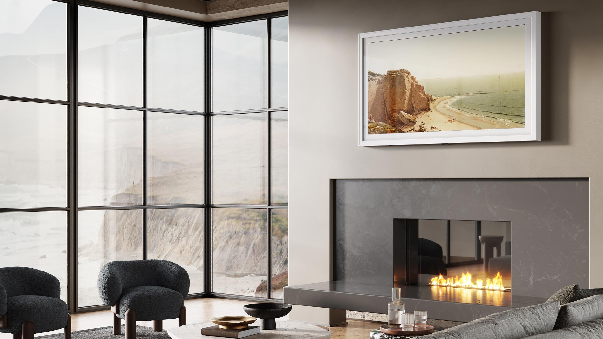 Close-up of a modern fireplace with a frame TV showing a coastal landscape