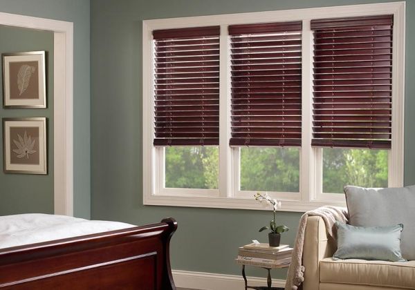 Lutron motorized wood blinds in a bedroom