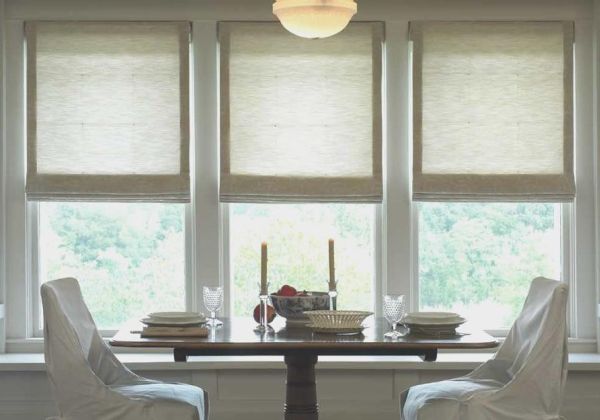 Lutron Roman shades in a dining area