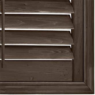 Close-up of dark wood Hunter Douglas shutters.